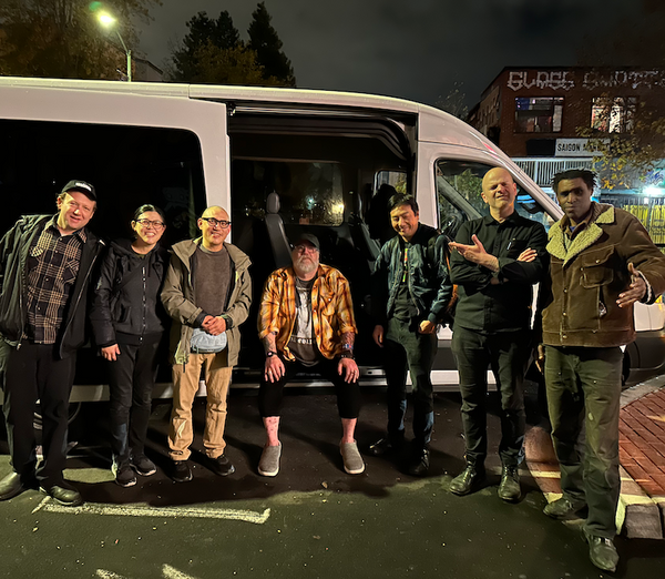 Left to right, Shaun Wagner, Yvonne Chen, George Chen, Andee Connors, Warren Ng, Marc Kate, Marshall Trammell standing outside the Stork Club, Dec 2, 2023, Oakland California